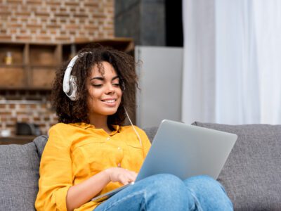 Featured Image For Office Music Playlist: Encouraging Songs to Inspire Your Team Team Building Post